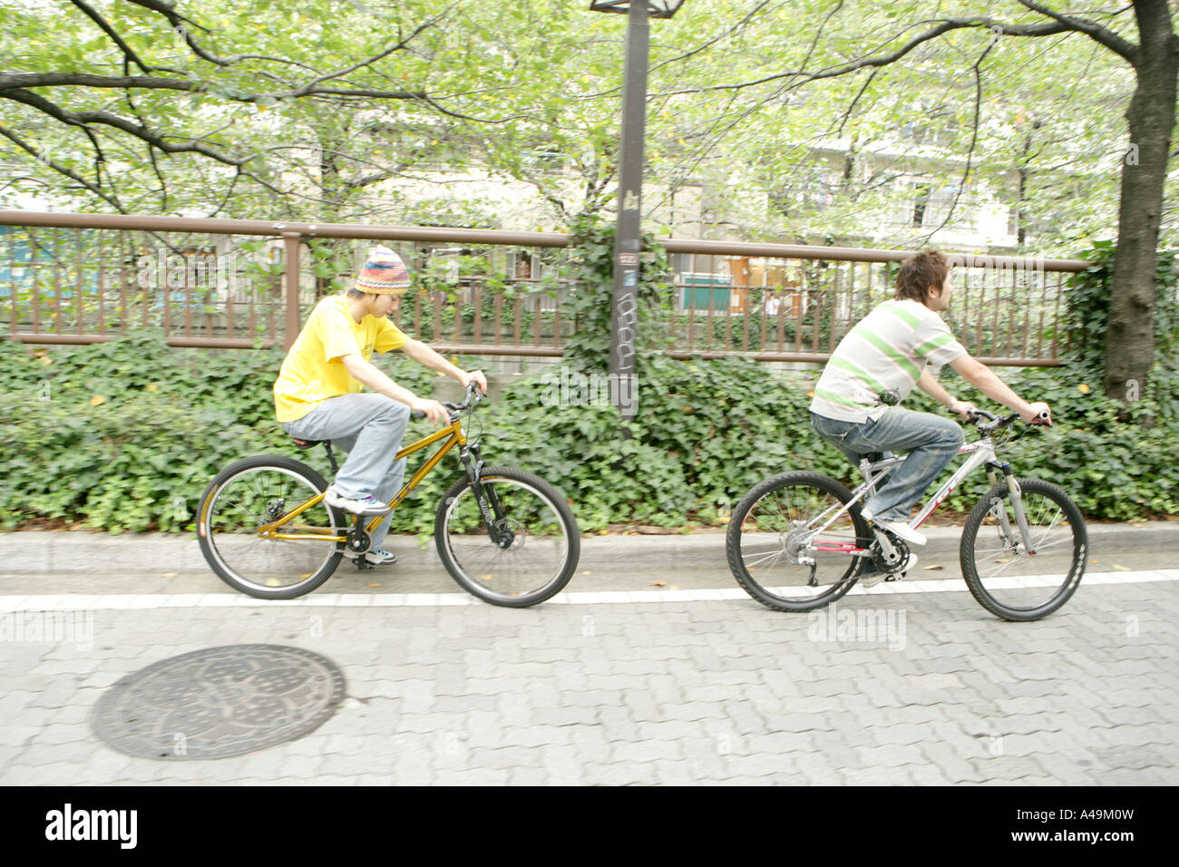 Two young men cycling hi-res stock photography and images - Alamy