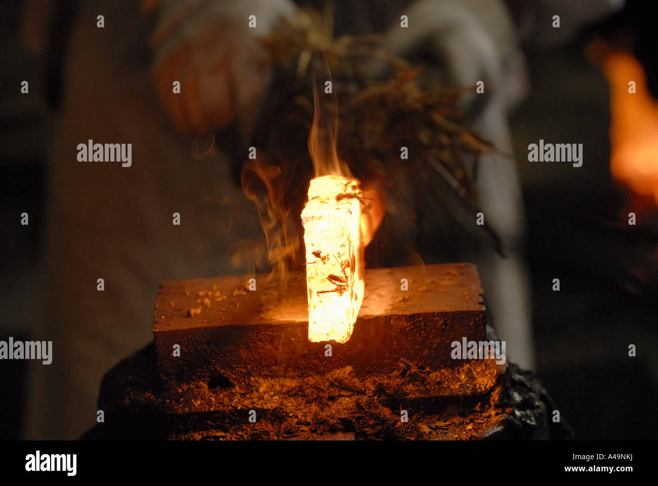 Close up of a heated iron rod on an anvil Stock Photo Alamy