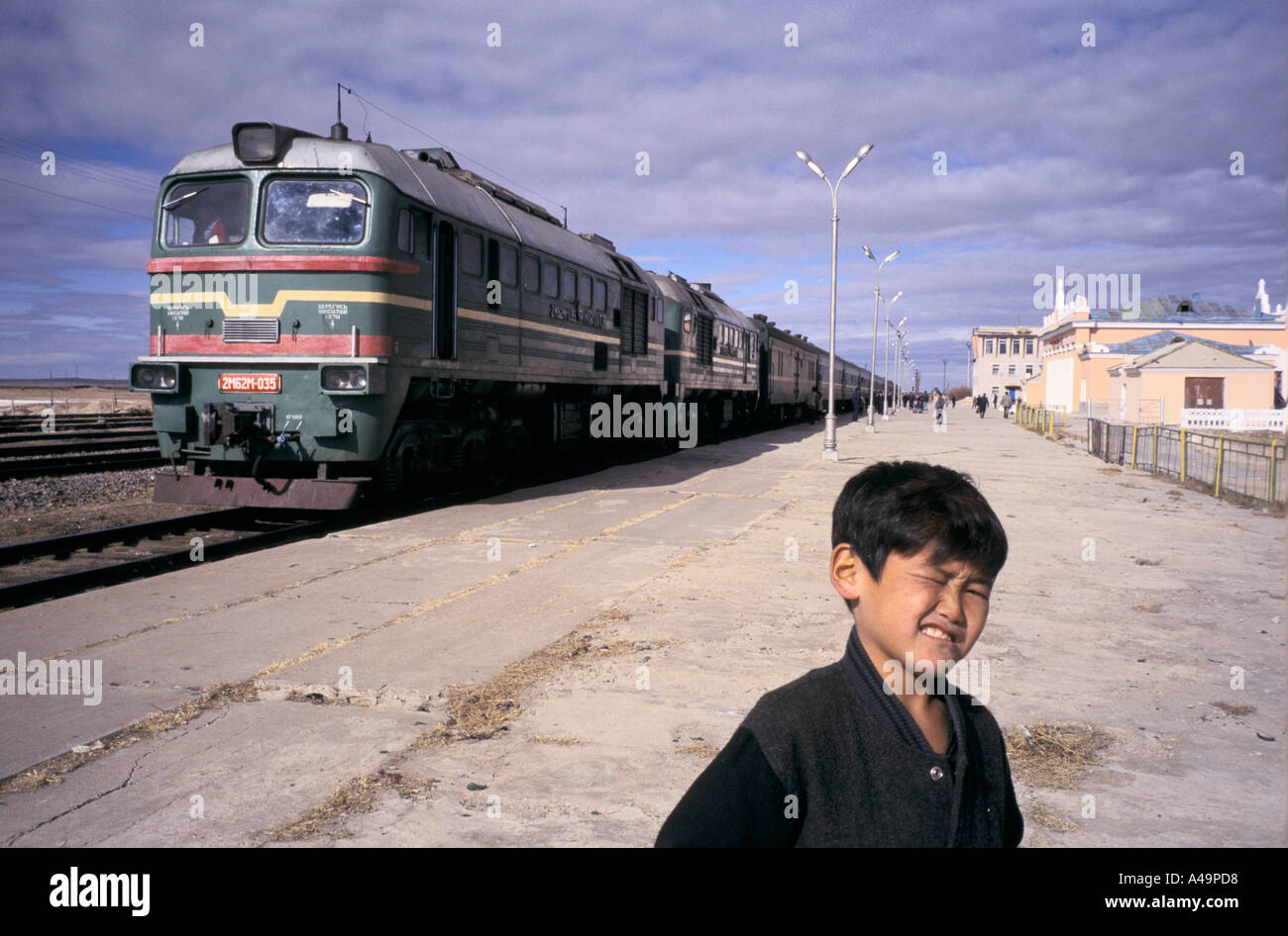 trans siberian rail journey train at a stop in the gobi desert section on the moscow to beijing route mongolia 1997 Stock Photo