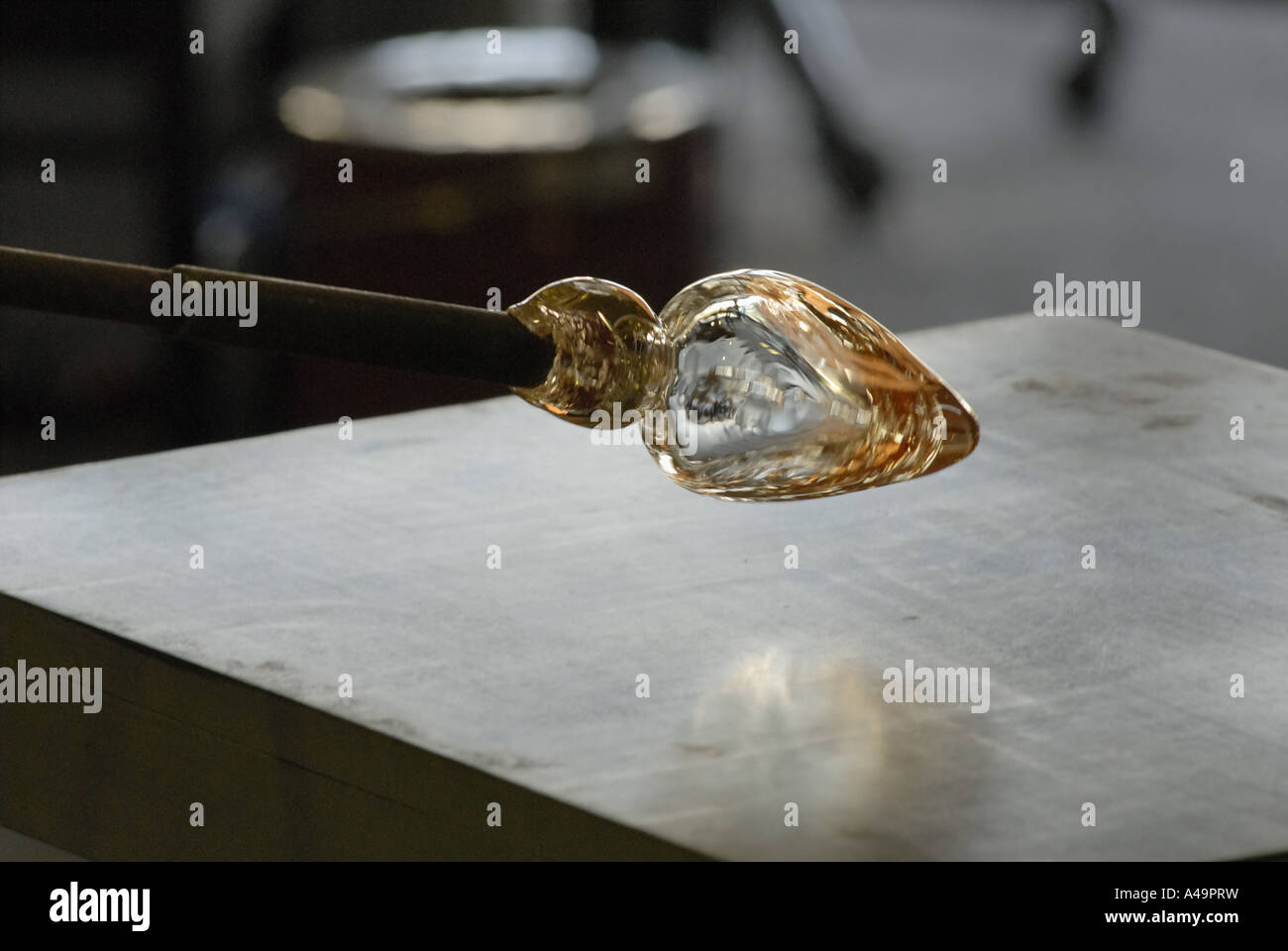 Molten glass at the end of a blow pipe Stock Photo Alamy