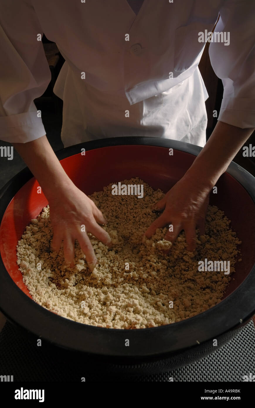 Mid section view of a chef mixing flour Stock Photo