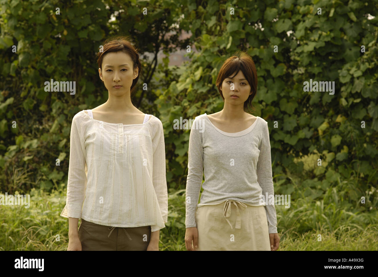 Portrait of two young women Stock Photo - Alamy