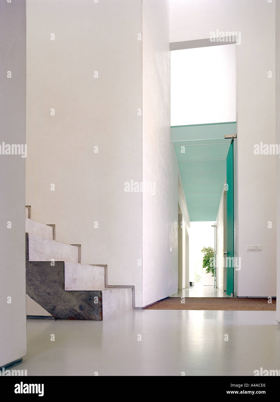 Hallway and concrete stairs in a modern family house designed by Pascal François architects Belgium  Stock Photo