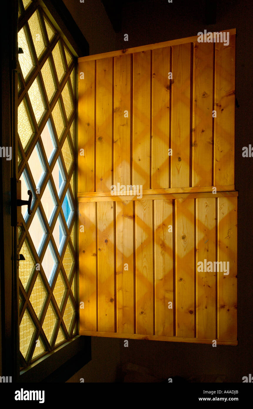 Window and shadows on shutter, Moroccan house Stock Photo