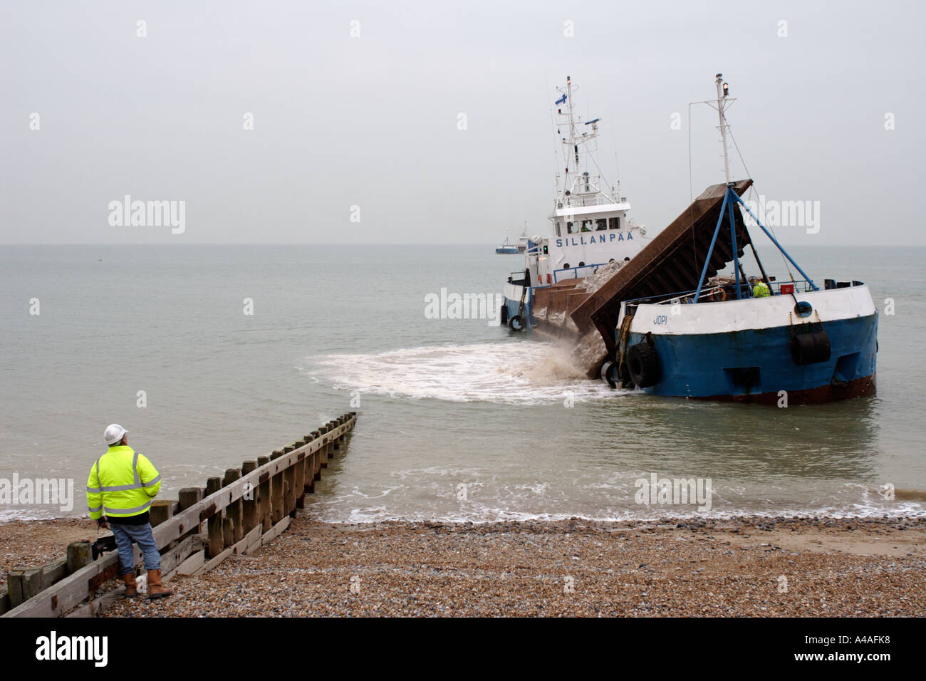 Finnish bulk ore carrier unloading rocks on Pevensey beach Stock Photo ...