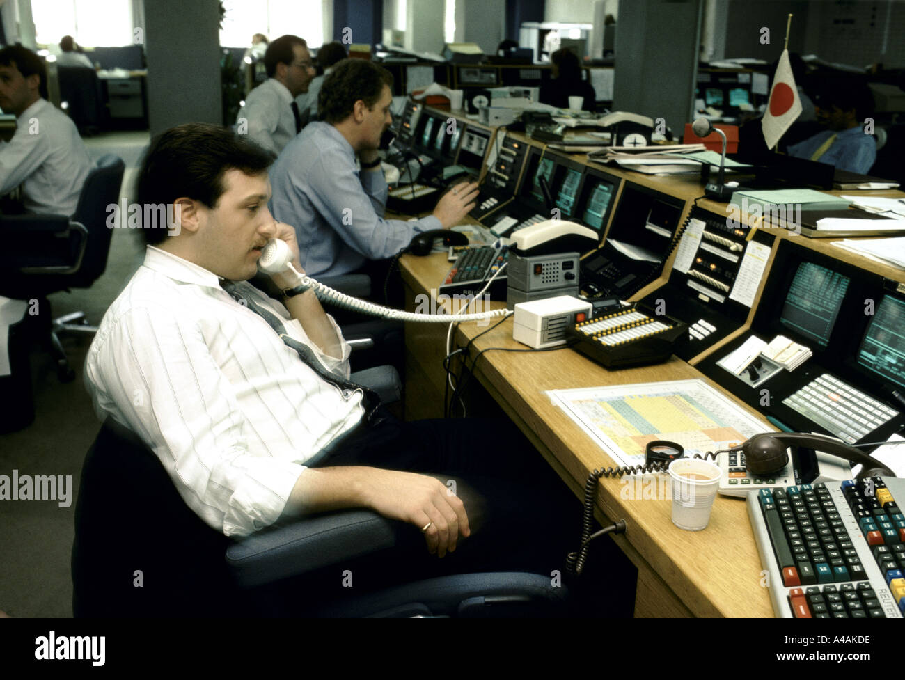 trader on the phone at work city of london soon after Big Bang in 1986 Stock Photo