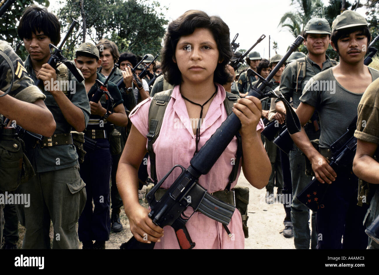 TENANCINGO,  EL SALVADOR, MARCH 1984:  a young women FPL rebel fighter lines up with other fighters to join an FMLN offensive. Stock Photo