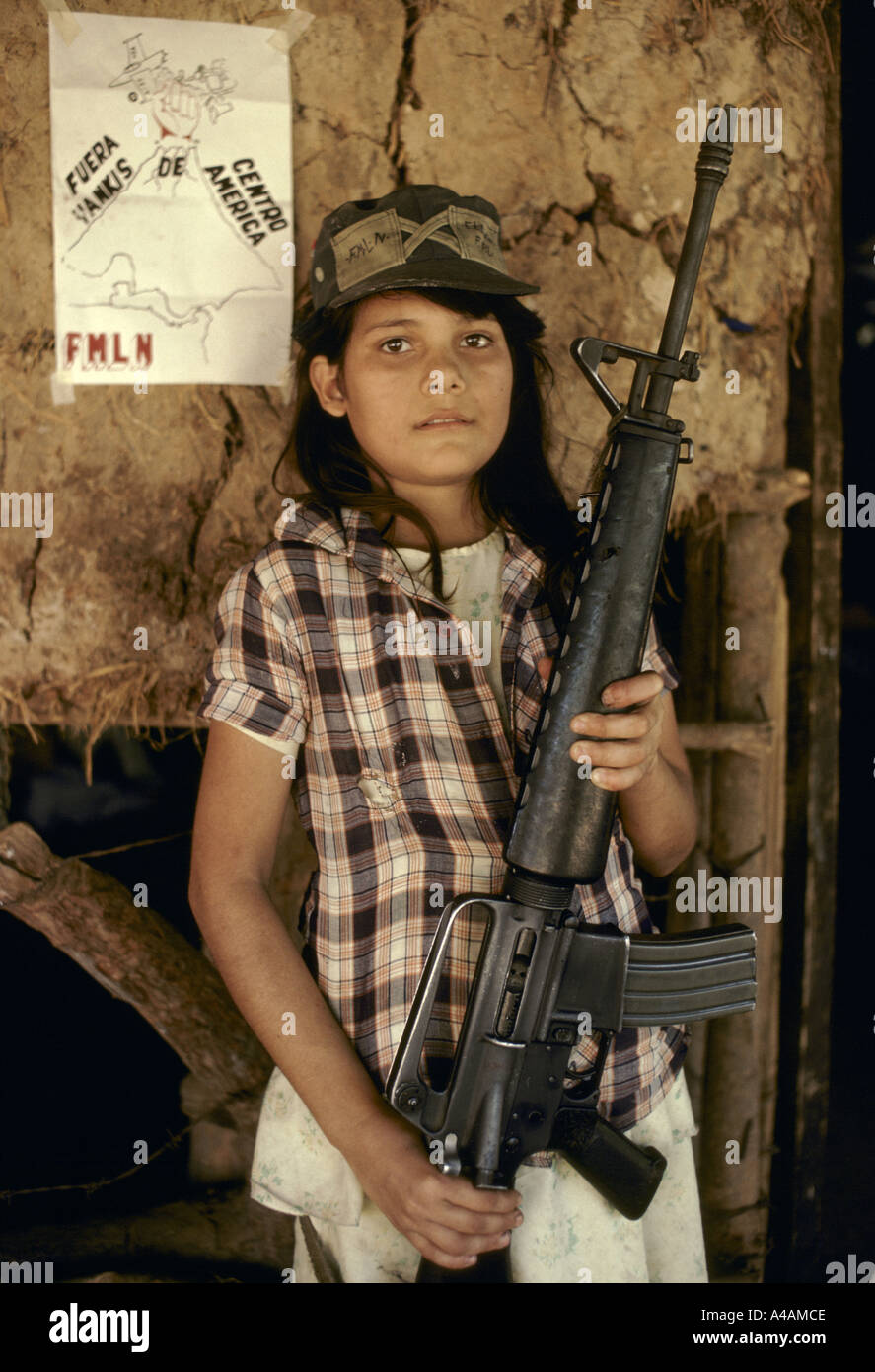 CHALATENANGO,   EL SALVADOR, FEB 1984: - Within the FPL Guerrilla's Zones of Control - A young girl holds an M16 rifle. Stock Photo