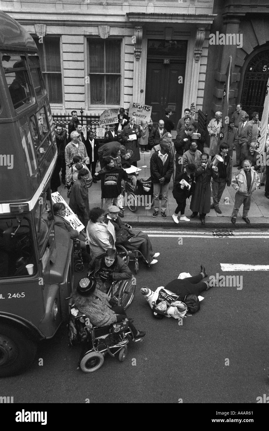 Disability transport protest by DAN (Direct Action Network) stops the traffic in Whitehall London England Stock Photo