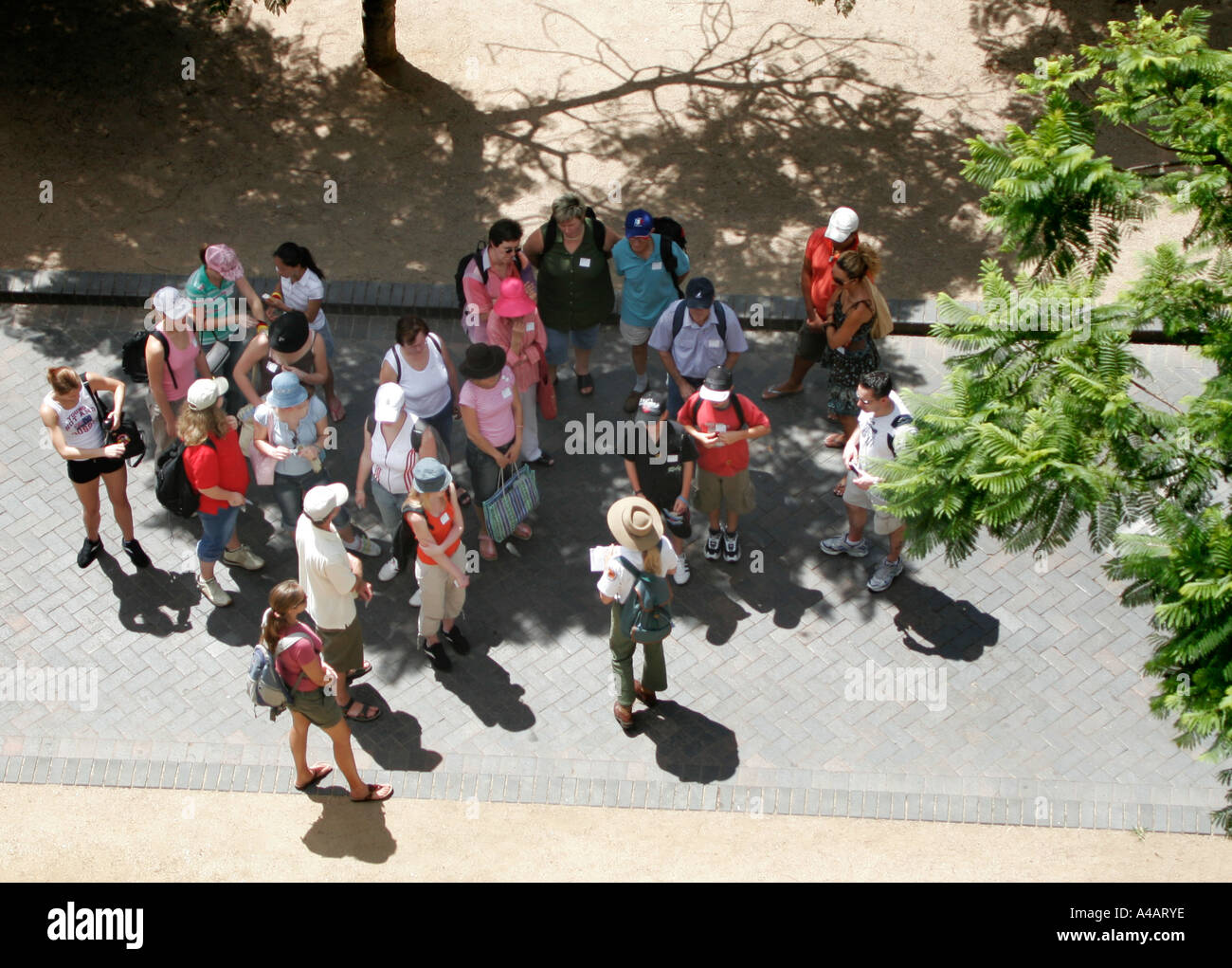 A group of tourists with National Parks ranger at Circular quay in Sydney Australia Stock Photo