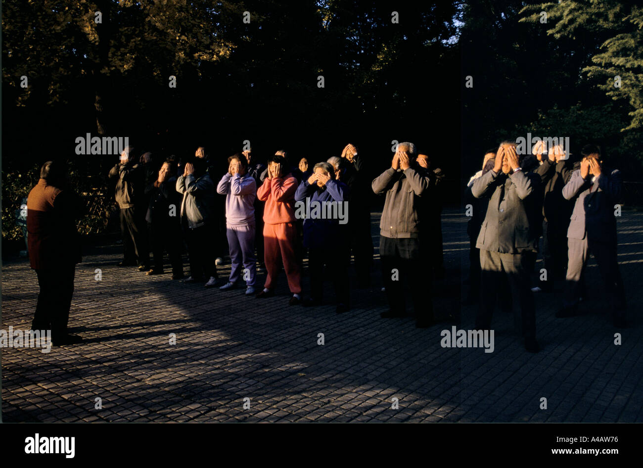 Beijing, China 1997:  People takes part in a Tai Chi class in the early morning at Ritan park Stock Photo