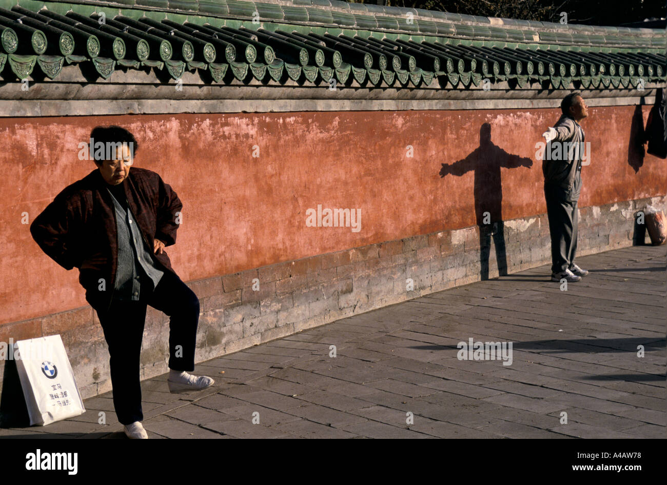 Beijing, China 1997:  A woman takes part in a Tai Chi class in the early morning at Ritan park Stock Photo