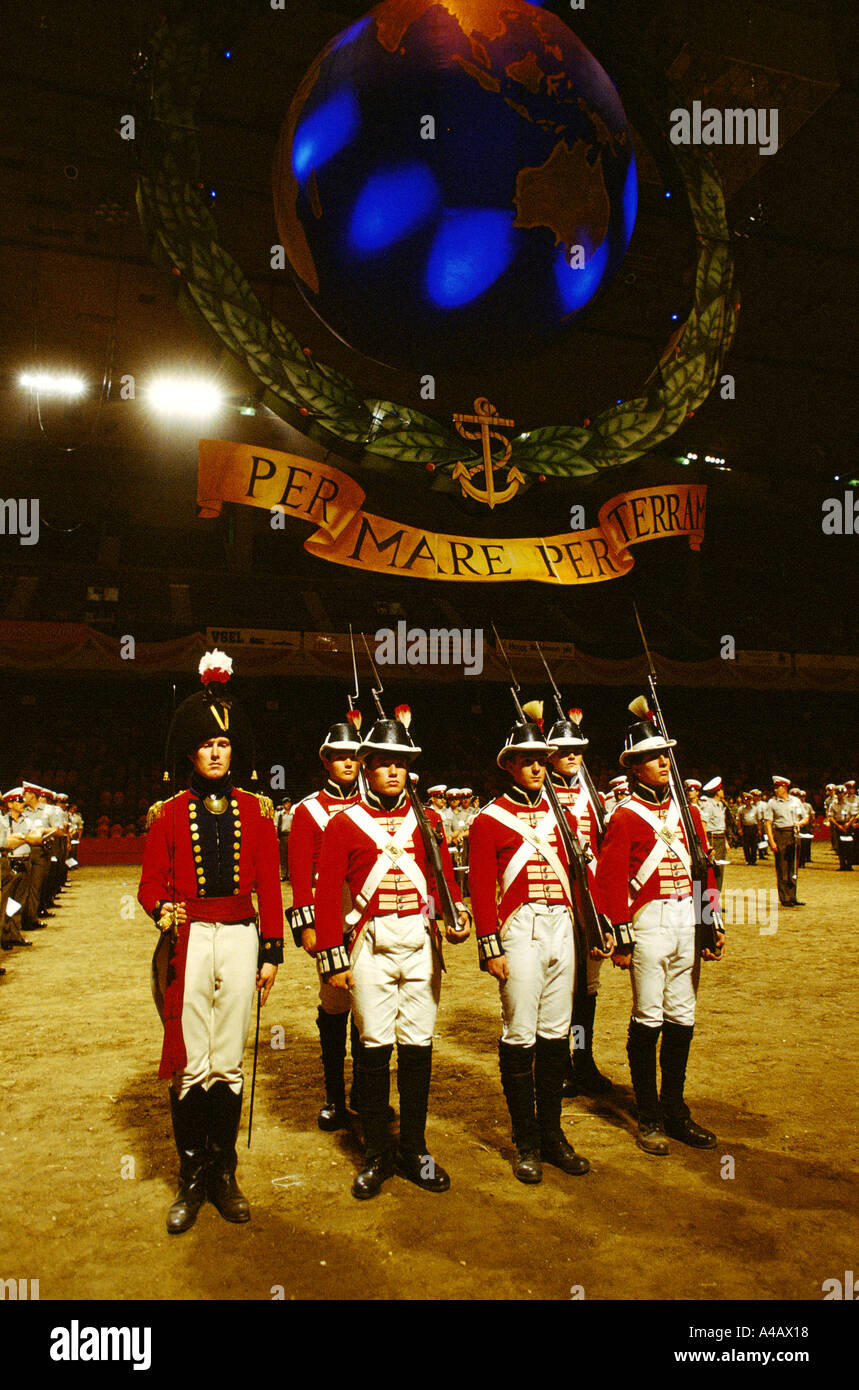 SOLDIERS IN ANTIQUE / TRADITIONAL UNIFORMS & RIFLES AT ROYAL TOURNAMENT, EARLS COURT LONDON ENGLAND 1990 Stock Photo