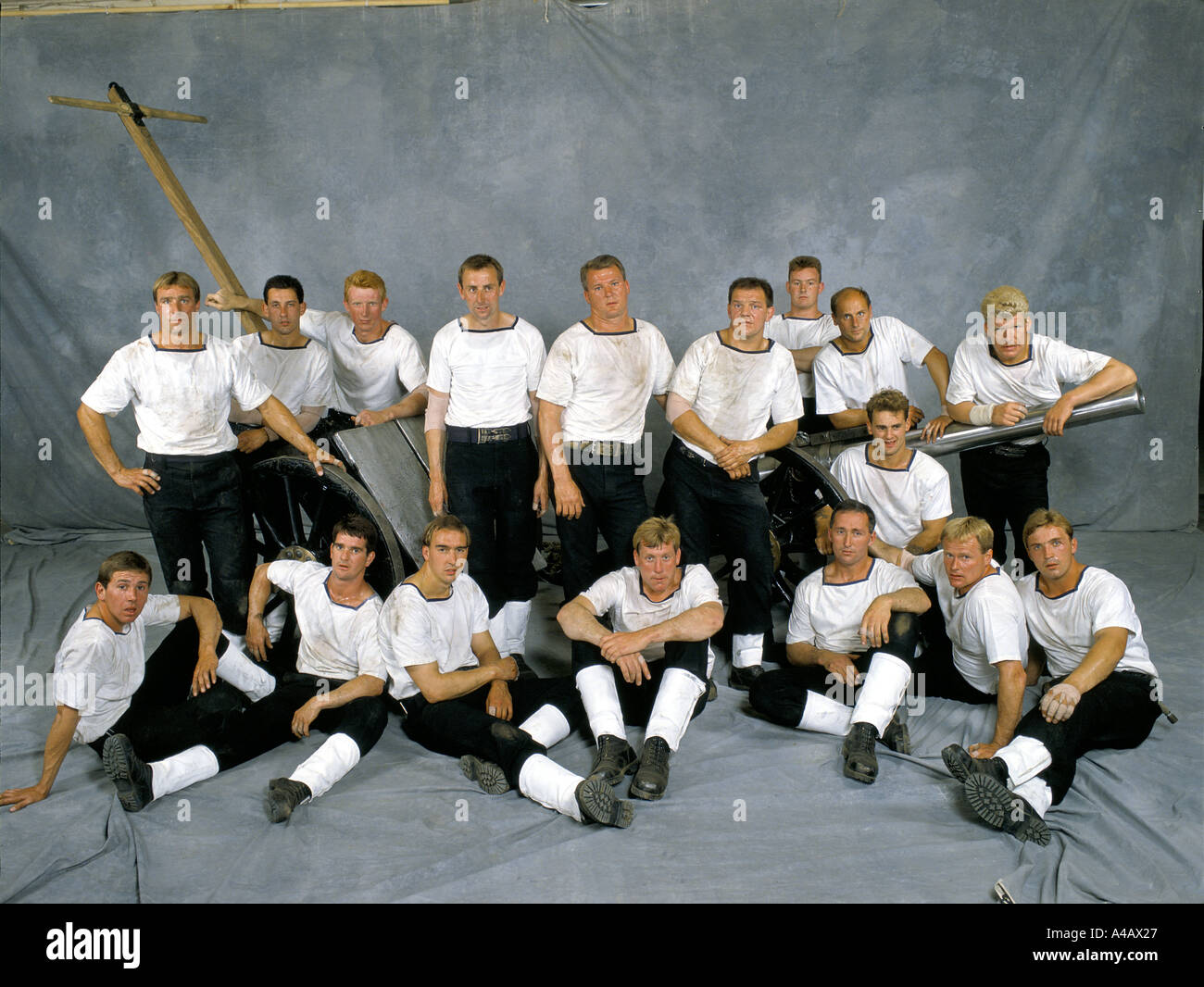 Fleet Air Arm field gun crew gather around their spare gun after their