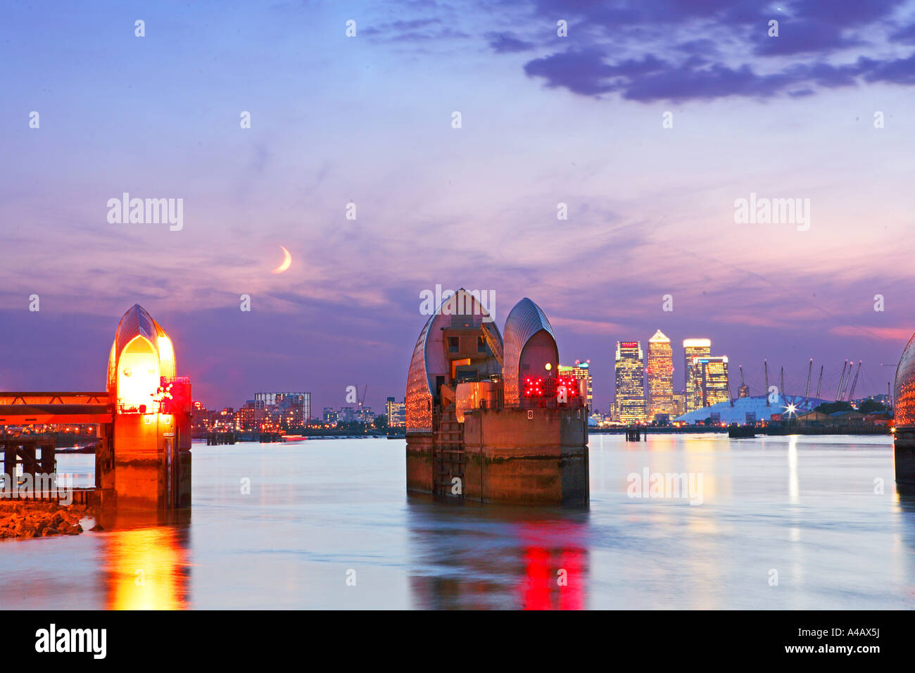 GB LONDON THAMES BARRIER AND CANARY WHARF AT DUSK Stock Photo - Alamy