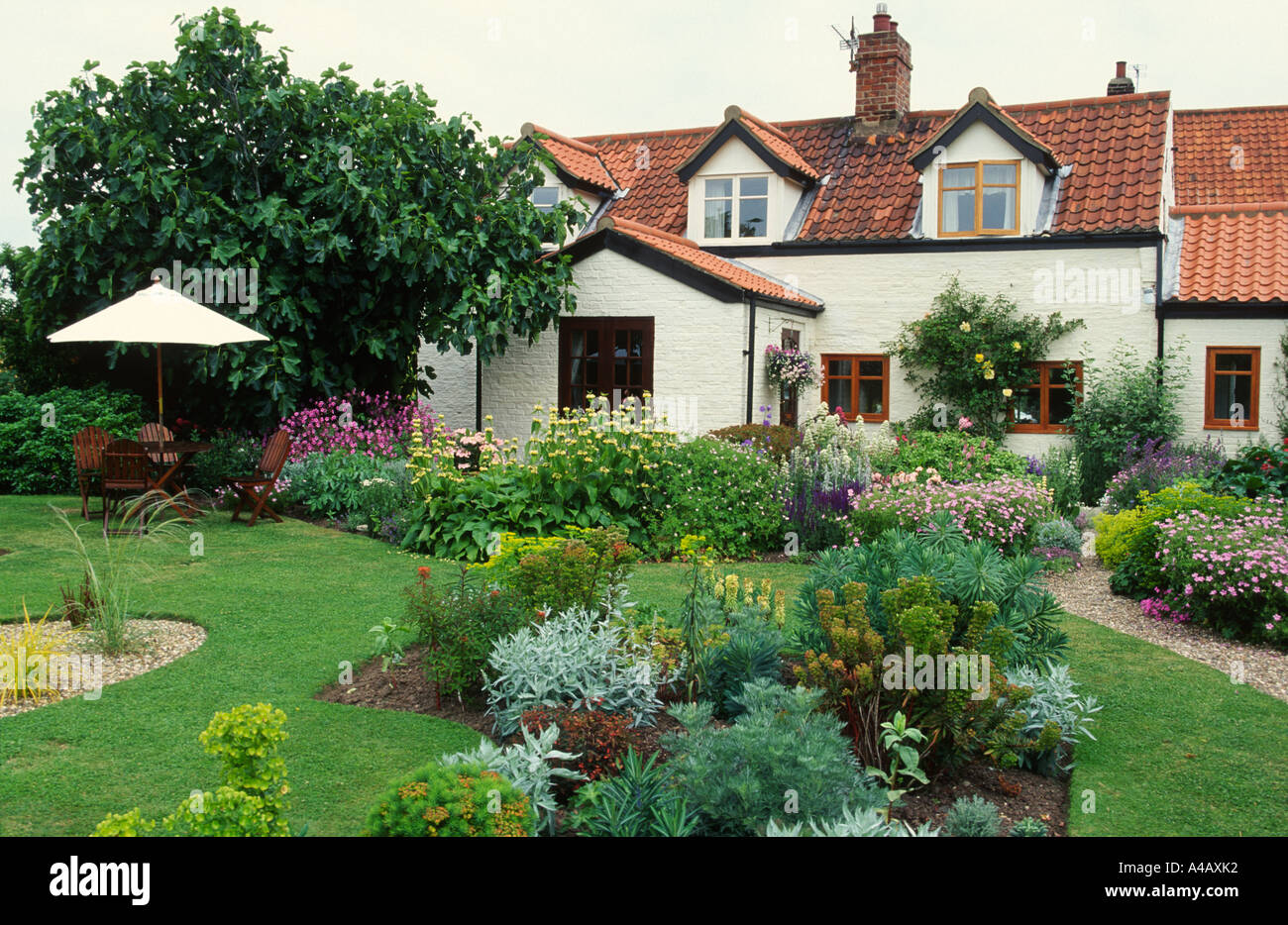 large cottage garden with sun shade Stock Photo