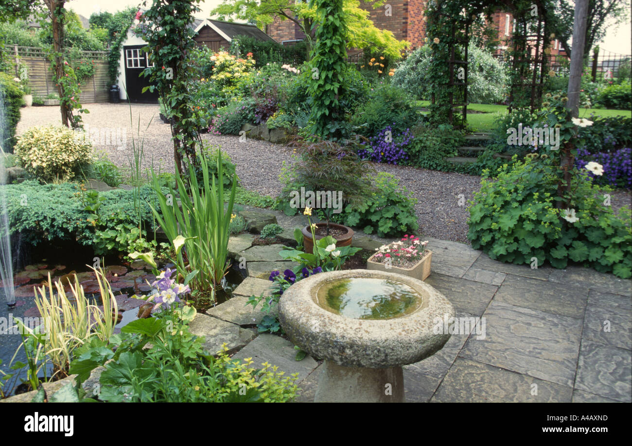 bird bath and pond in wildlife friendly garden Stock Photo Alamy