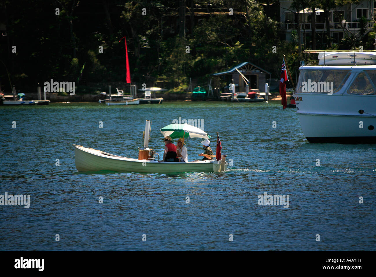 A classic steam powered lap-strake or clinker built dinghy on Sydney's Pittwater Stock Photo