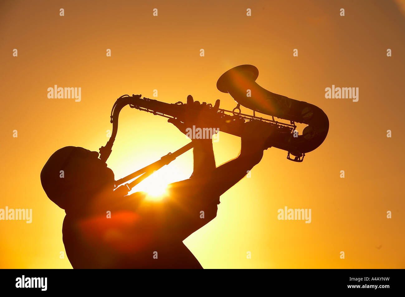 Silhouette of man playing the saxophone Stock Photo