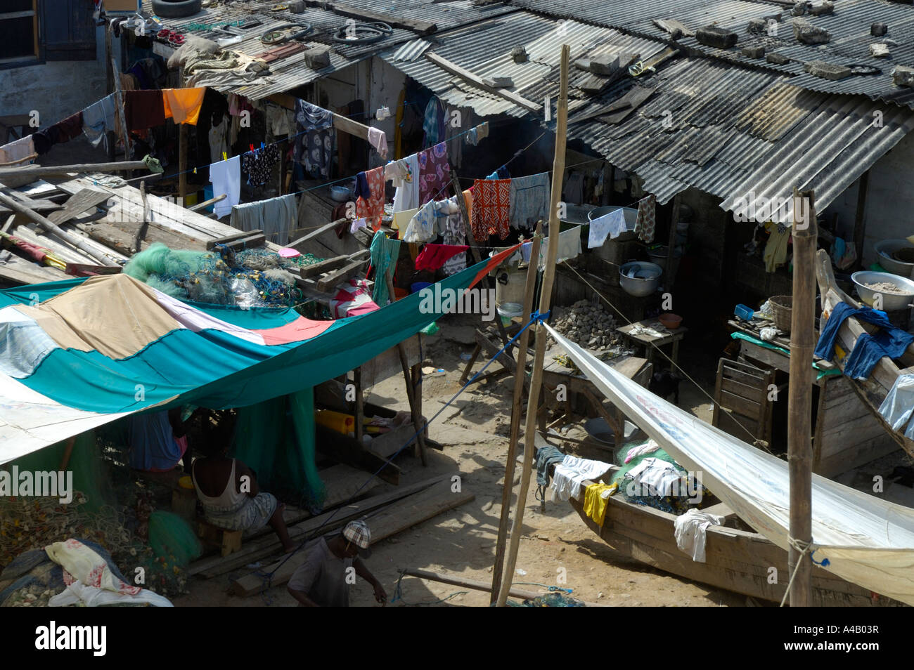 View into a backyard of shanties with lines of clothes in Cape Coast, Ghana, Africa Stock Photo