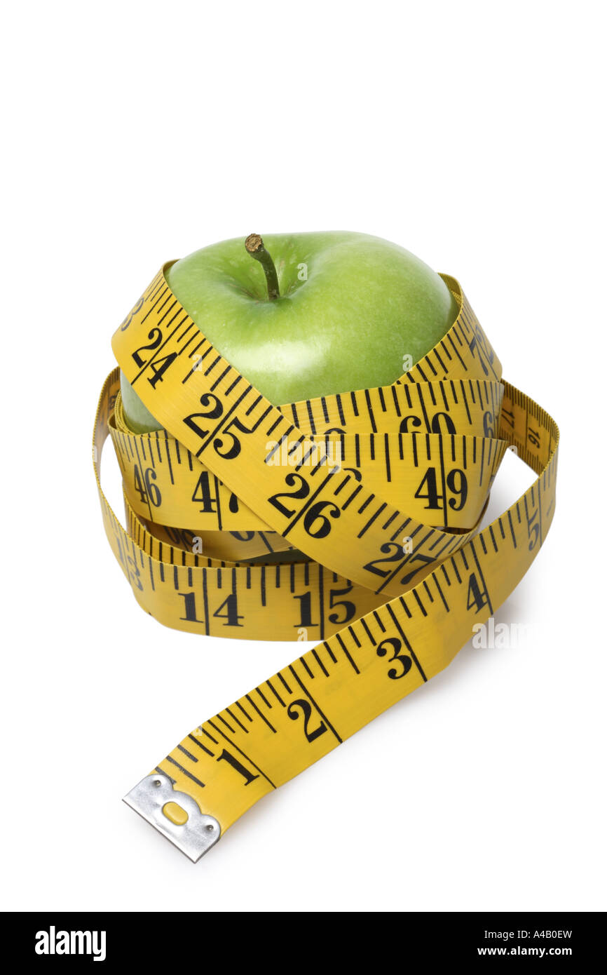 Tape Measure wrapped around Apple cut out on white background Stock Photo