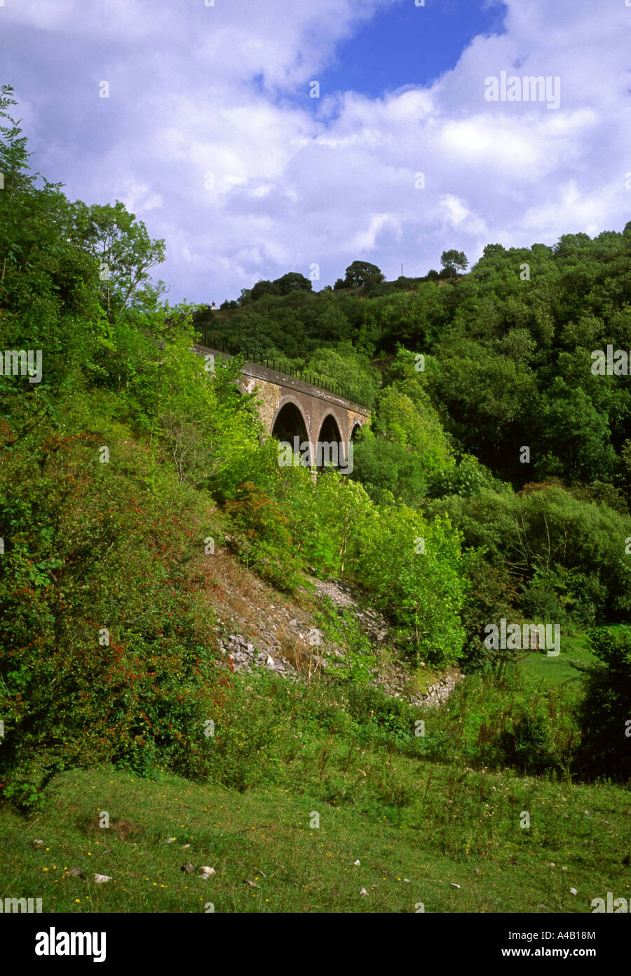 View of disused railway viaduct in Monsal Dale in the Peak District Derbyshire England Stock Photo