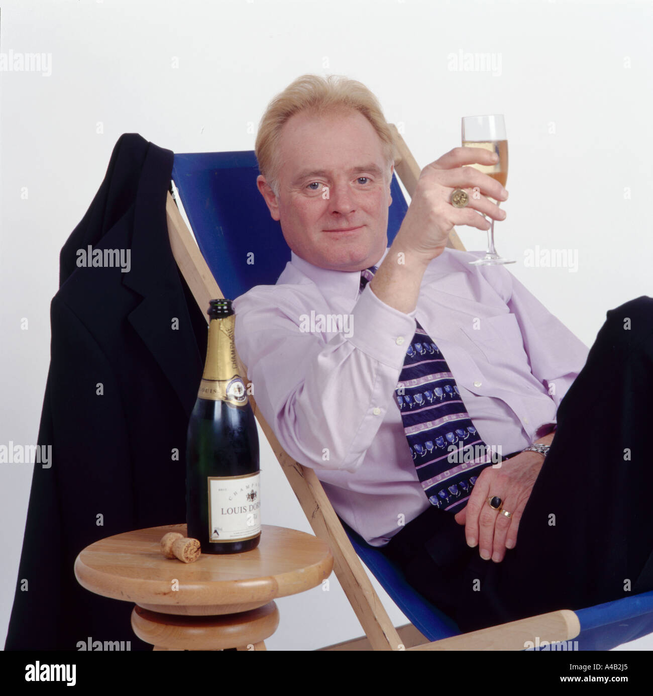 Actor Bruce Jones enjoying a champagne Stock Photo Alamy