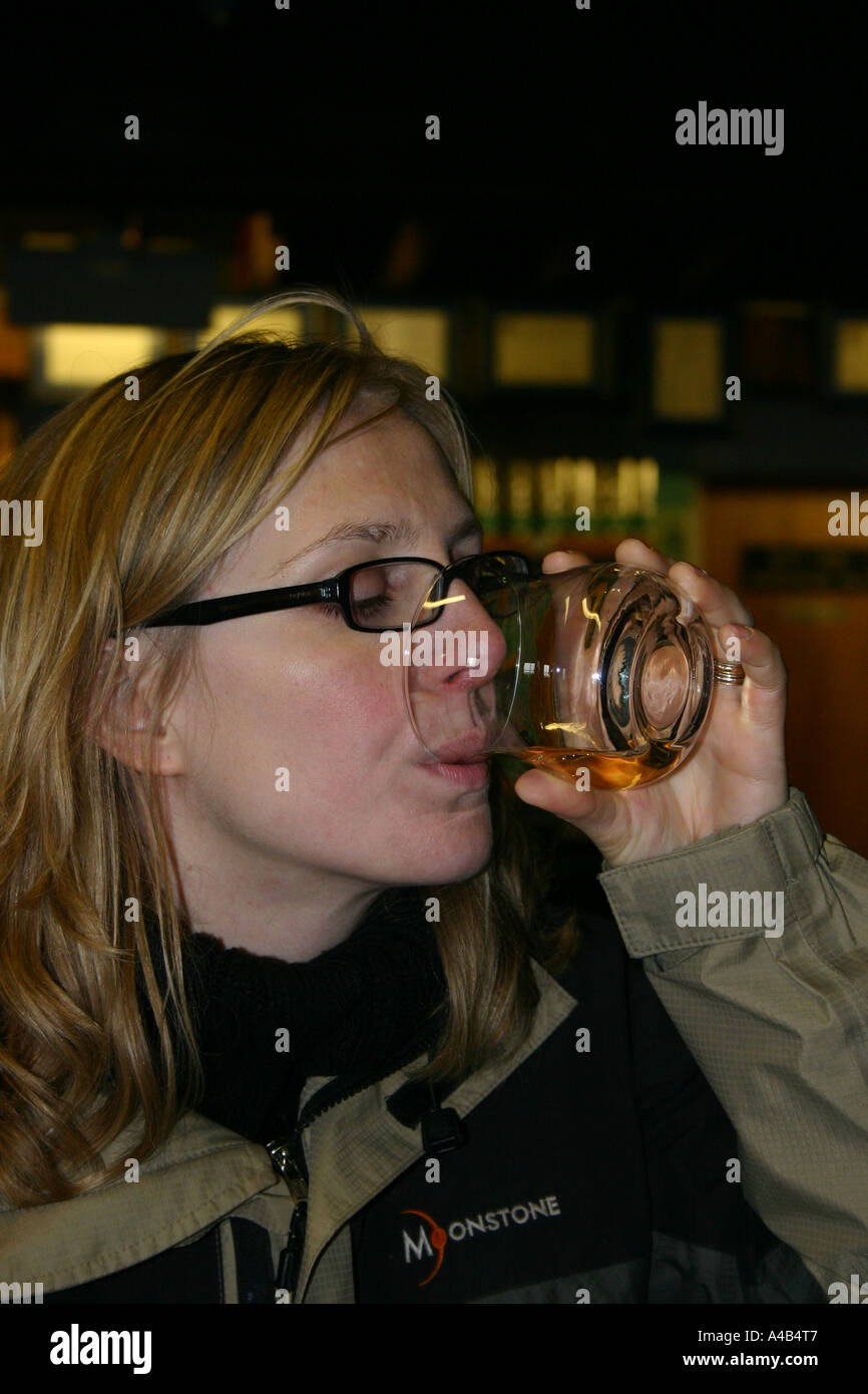 Tourist Tasting Scottish Whisky on Whisky Tour Stock Photo