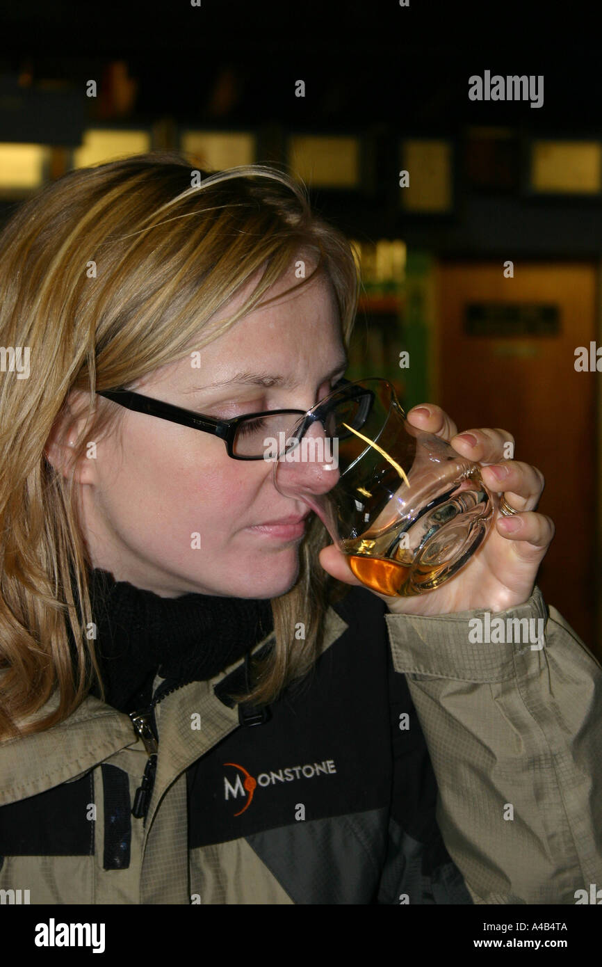 Tourist Tasting Scottish Whisky on Whisky Tour Stock Photo