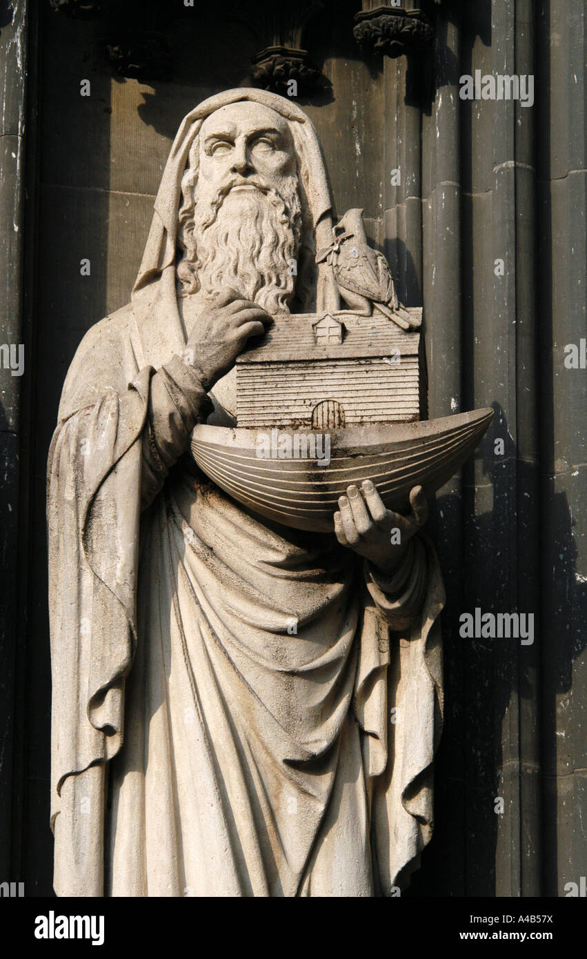 Gothic statue of Noah with the Noah's Ark in his hands on the facade of the Cologne Cathedral in Cologne, Germany. Stock Photo