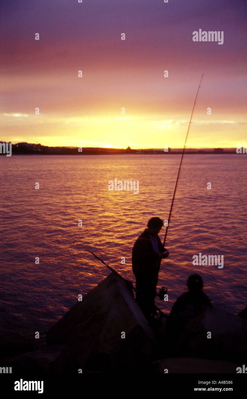 sunset over water Stock Photo - Alamy