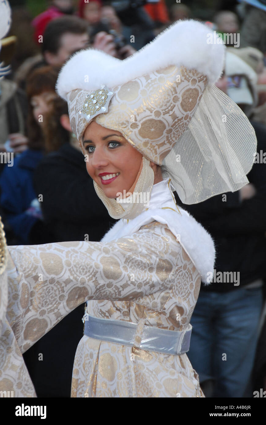 An attractive young woman wearing a costume, during a parade at Disneyland Paris Stock Photo