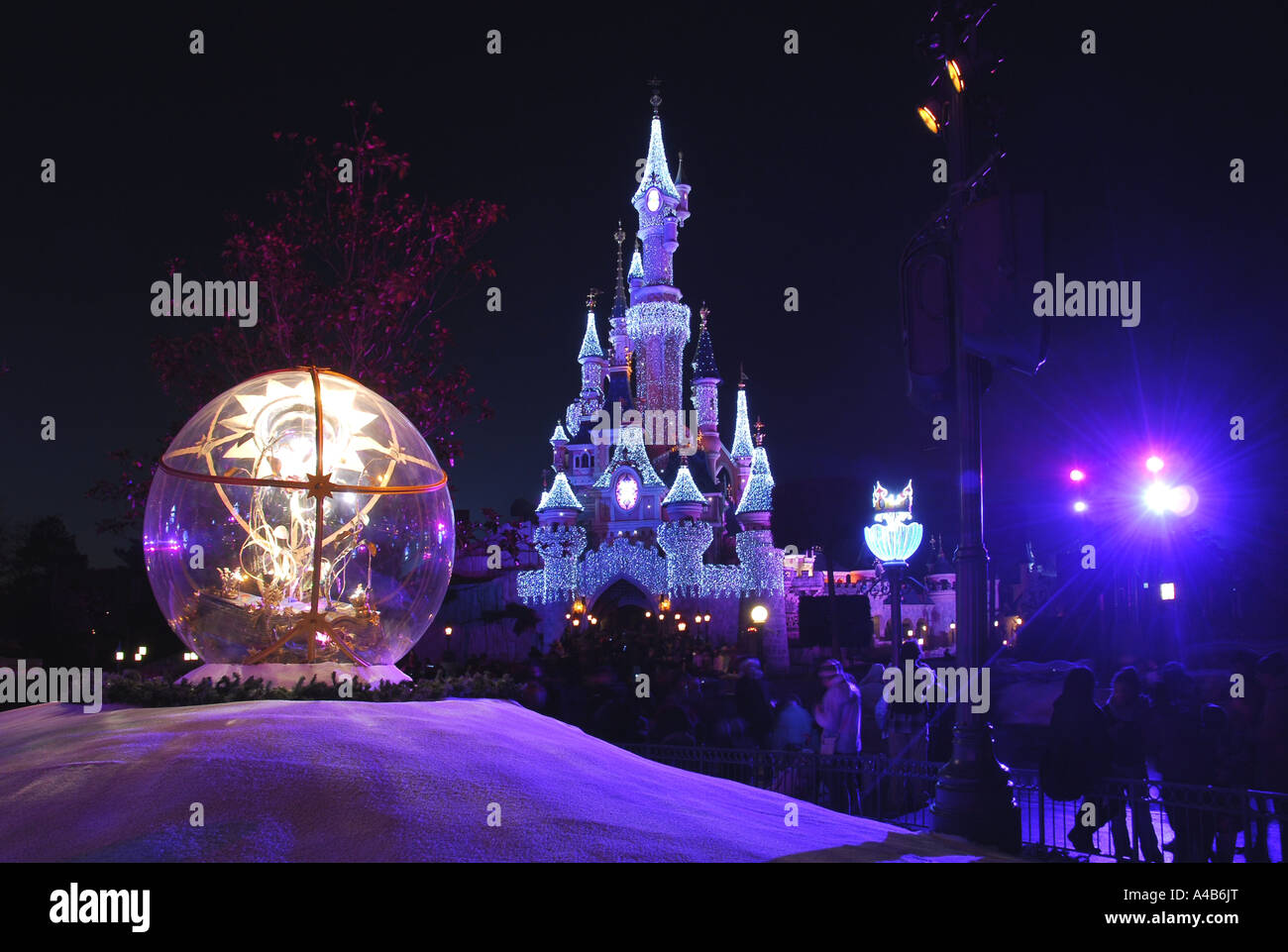 Christmas lights illuminate the Fairy tale castle at Disneyland in Paris. Stock Photo