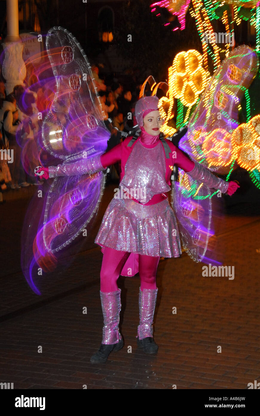 A dancer dressed as a butterfly during the Christmas parade at Disneyland in Paris Stock Photo