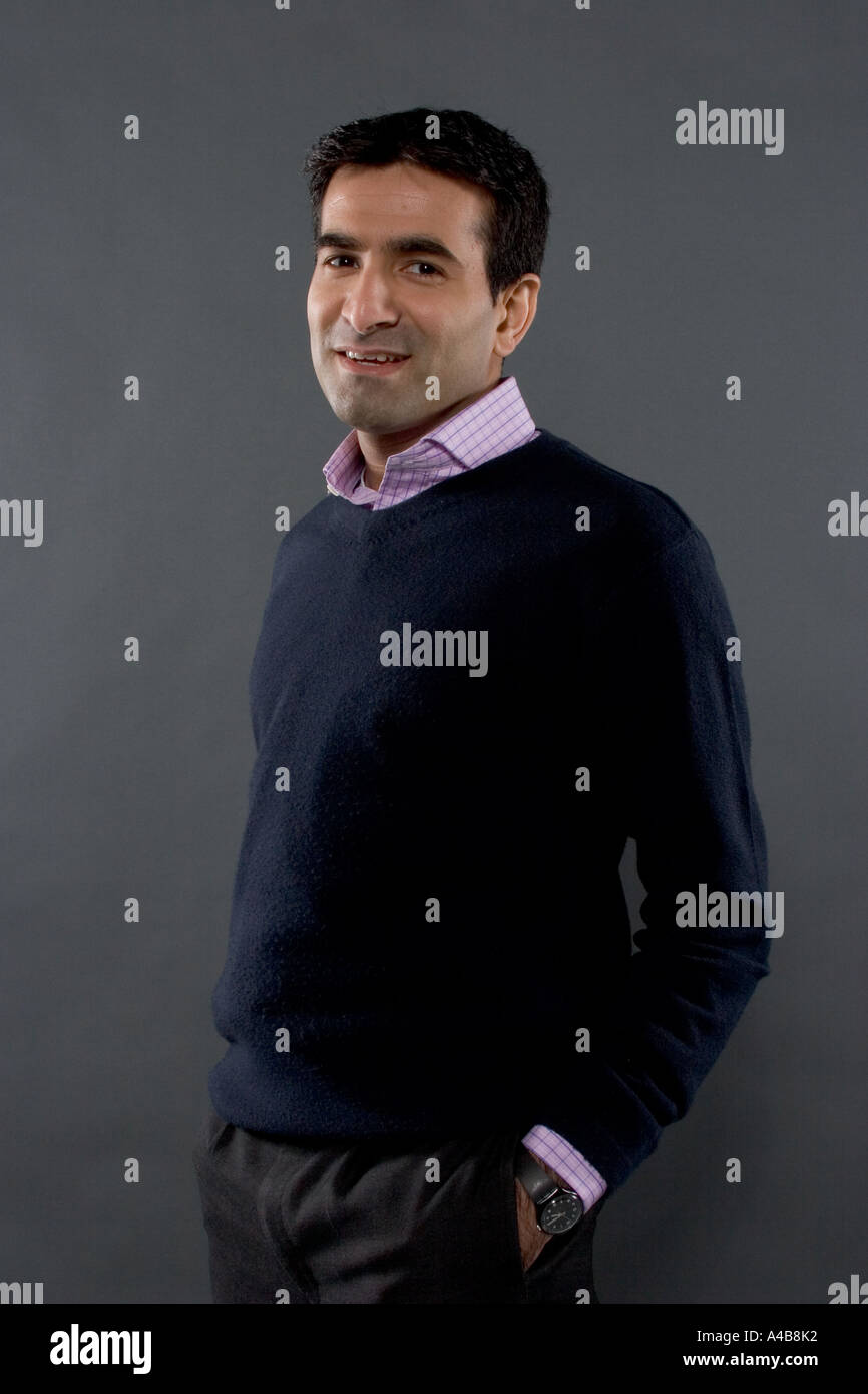 Happy man with hands in pockets Stock Photo