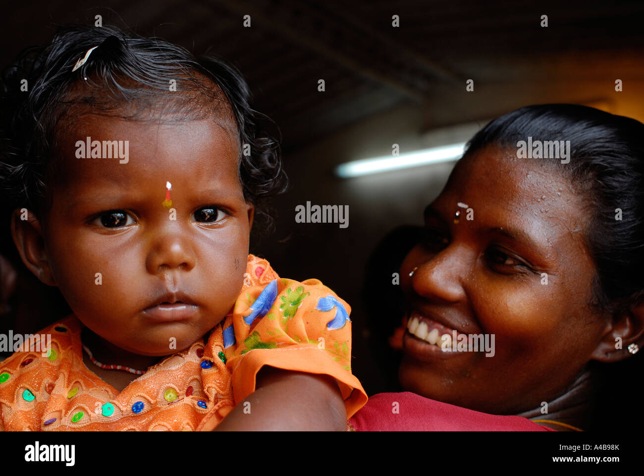 Stock image of Indian tribal village mother and baby near Chennai Tamil