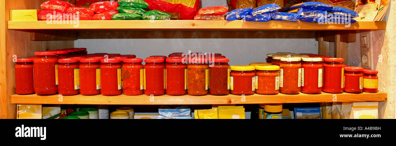 panorama shot of row of tomato sauce on shelf in store Stock Photo