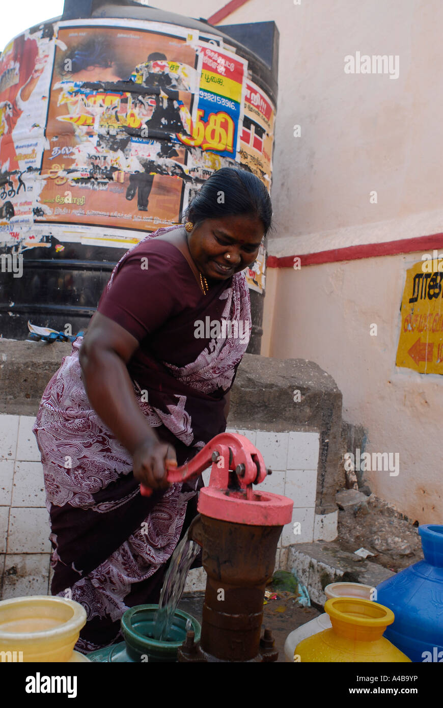 Stock Image of Dalit Women at communal community well in Jagathapuram slum in Chennai Tamil Nadu India Stock Photo