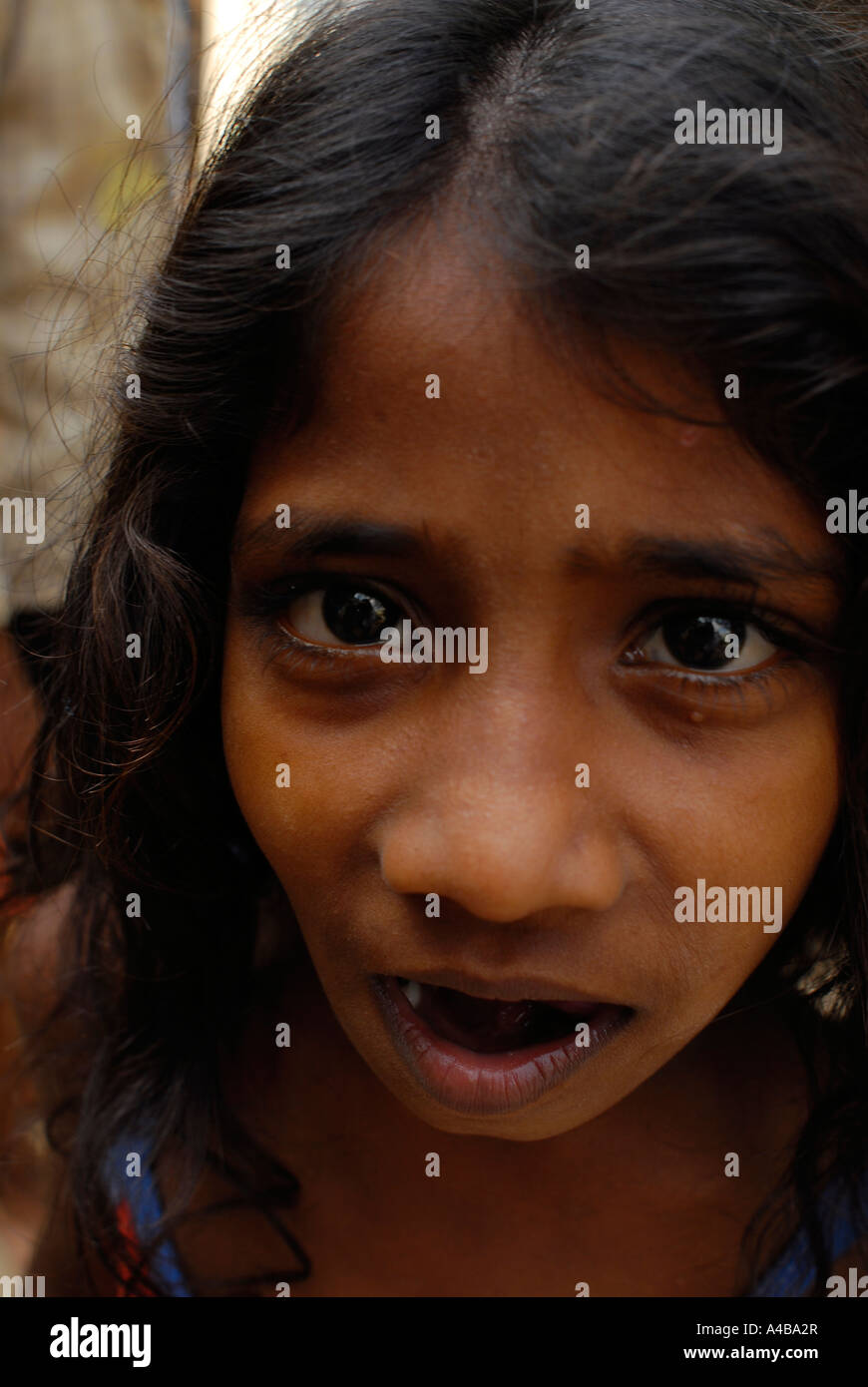 Stock Image of young Dalit girl with long hair at community well in  Jagathapuram slum in Chennai Tamil Nadu India Stock Photo - Alamy