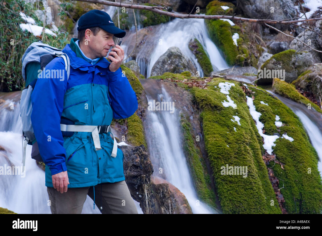 hiker near waterfall Stock Photo