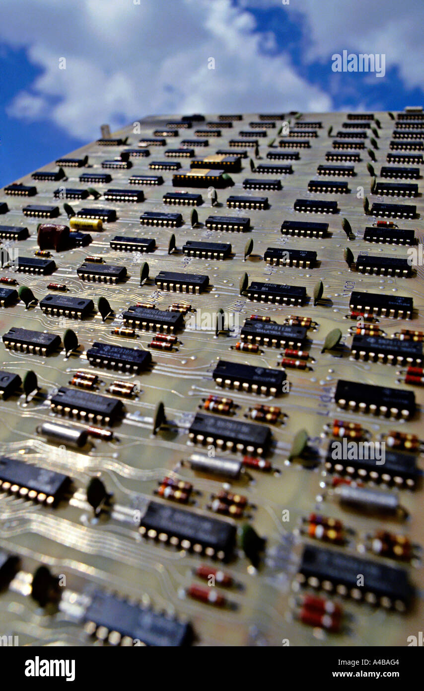 Microprocessor chips on computer circuit board with sky as backdrop Stock Photo