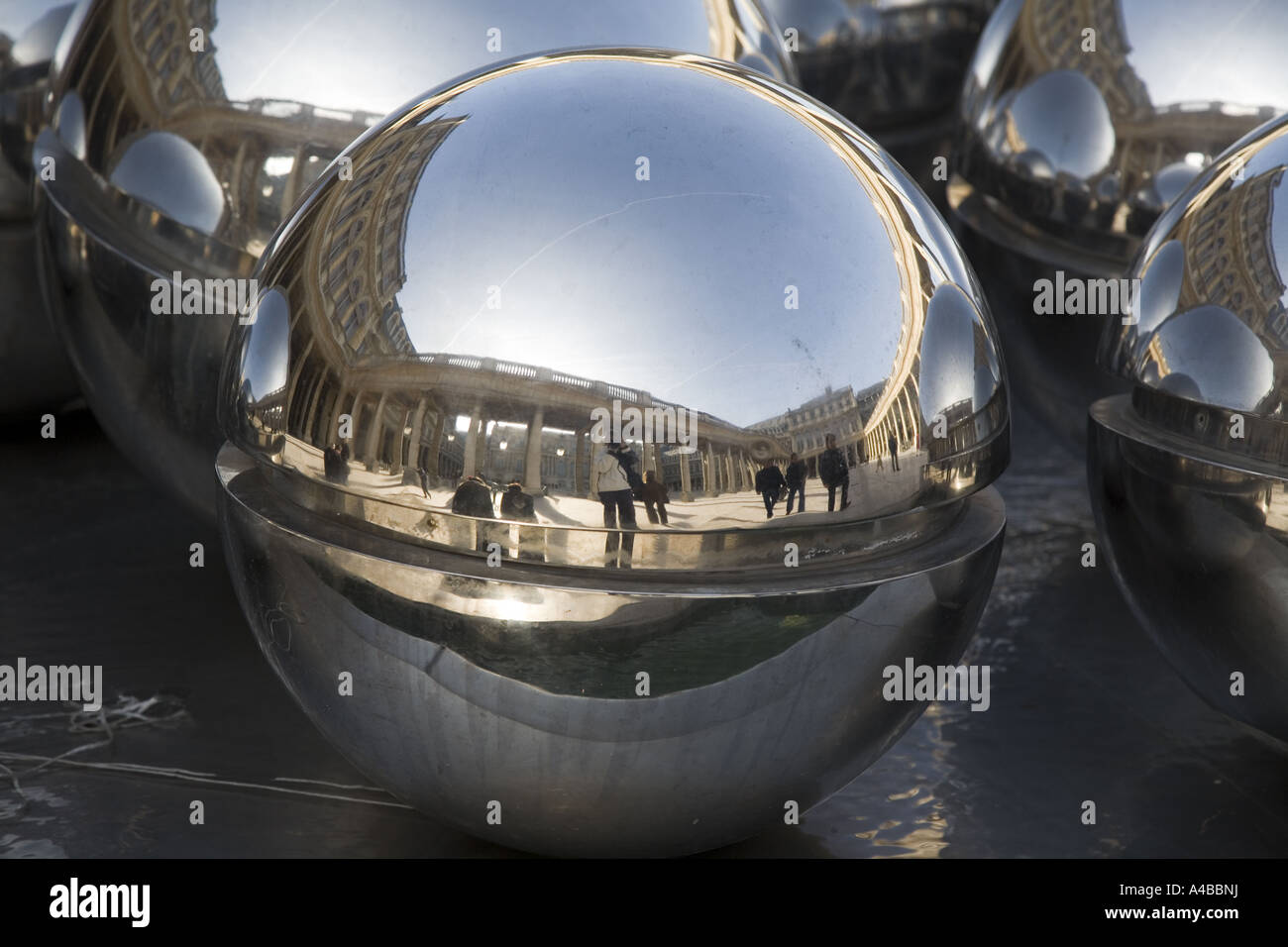 Reflecting ball sculpture in the gardens of Royal Palace Courtyard Paris France Europe Stock