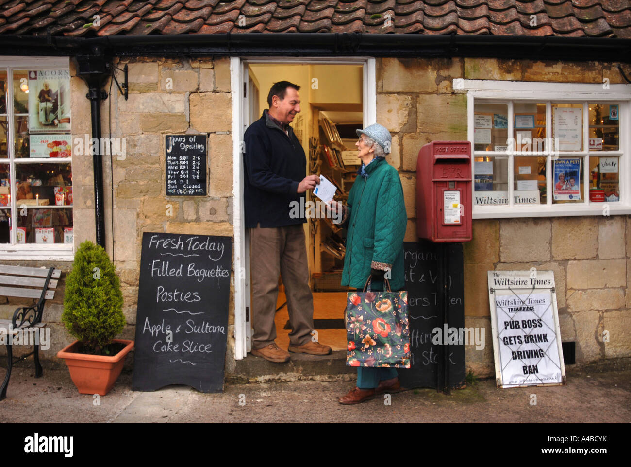 THE VILLAGE SHOP AND POST OFFICE AT MONKTON FARLEIGH WILTSHIRE UK WHICH IS UNDER THE THREAT OF CLOSURE DEC 2006 Stock Photo