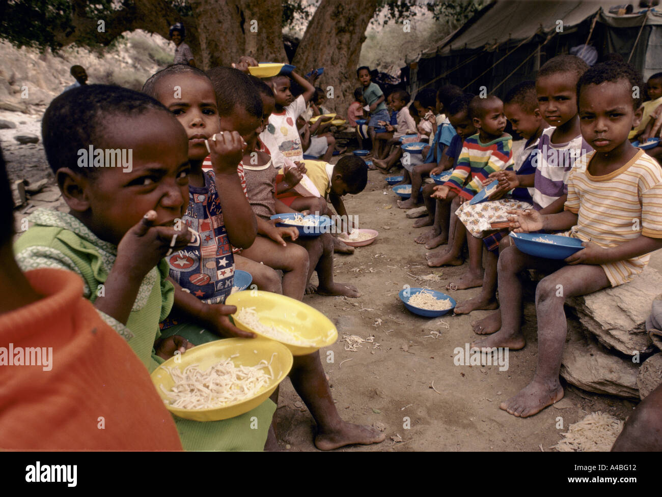 Eritrea: war orphans and children of EPLF fighters eat their mid-day meal at a school in the EPLF's base area in severe drought. Stock Photo
