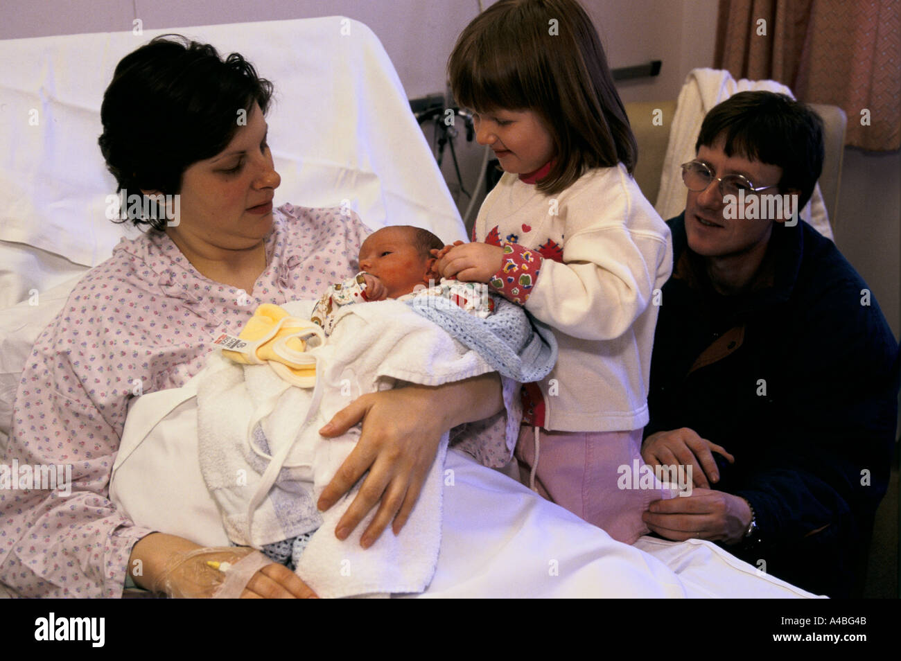 Maternity Unit, Homerton Hospital, London, England A mother shows off