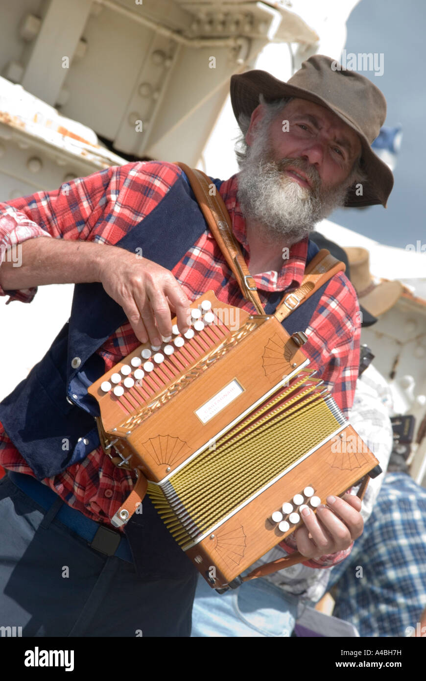 A performer at the Australian Wooden Boat Festival 2007 in Hobart Tasmania playing a small accordian in a country music band Stock Photo