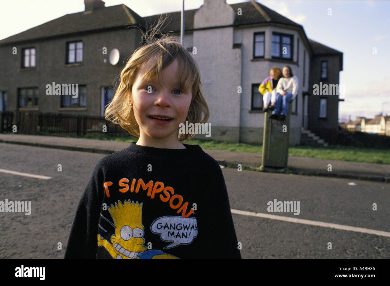 Motherwell, Scotland. Girls playing. The Ravenscraig steel works, which