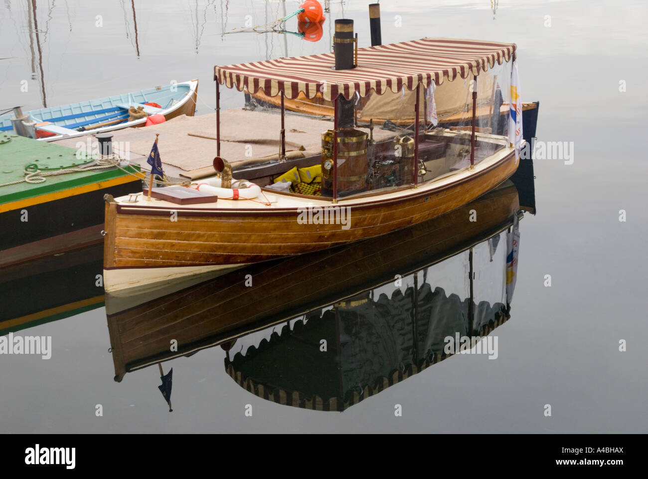 A fine steamboat floats on its own reflection in the early morning at the Australian Wooden