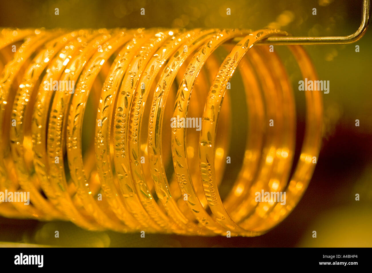 Kuwait Gold Soukh Warm gold bracelets in a shop window picking up highlights and reflections