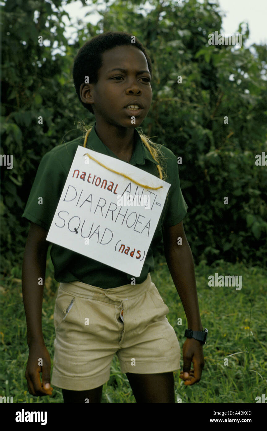 Uganda: A boy with placard around his neck reading 'national anti diarrhoea squad' during an immunization day Stock Photo